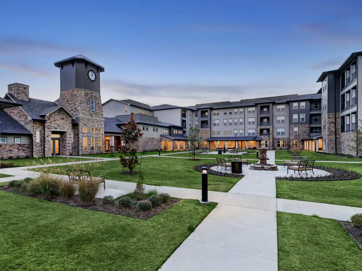 The Lodge at Pine Creek Exteriors - Twightlight - Great Lawn Facing IL Courtyard