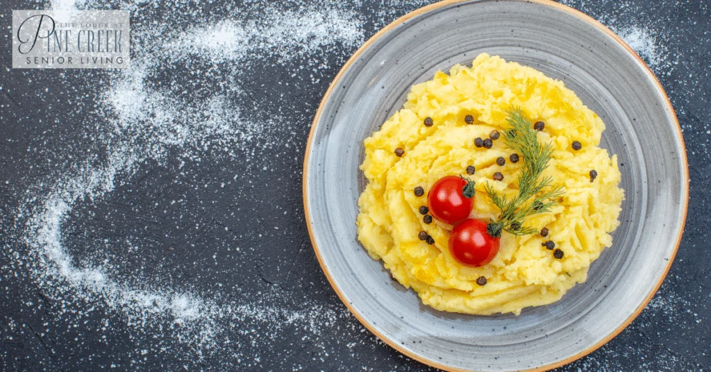 Memory care dining. An above view of delicious mashed potato meal served.