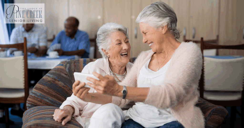 In a warm and supportive environment, elderly women enjoy moments of connection and laughter, highlighting the importance of dementia care for the elderly. These joyful moments are vital for emotional well-being and maintaining cognitive function.